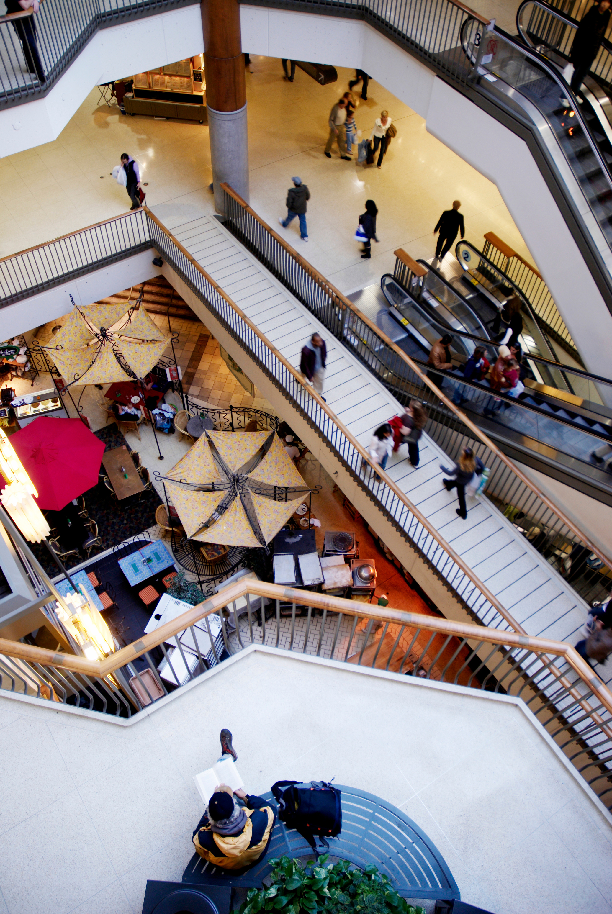 man reading in mall